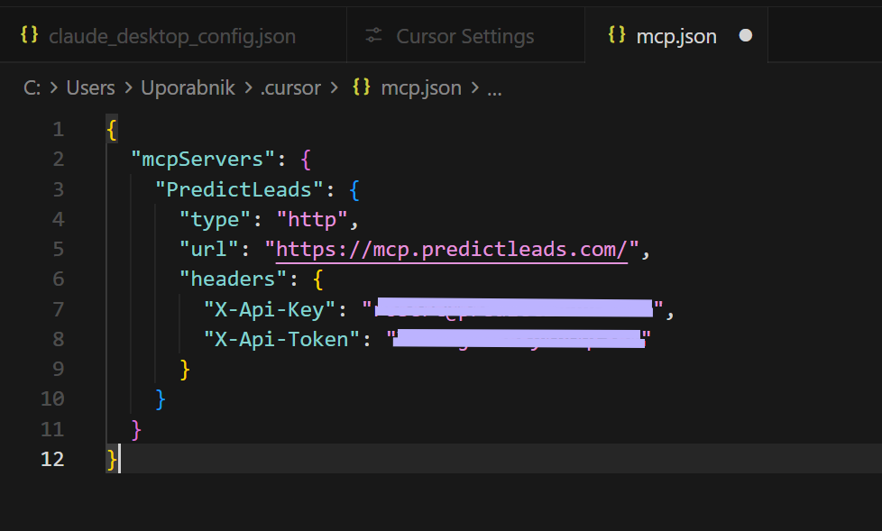 JSON configuration file showing the PredictLeads MCP server setup with API key and API token headers.